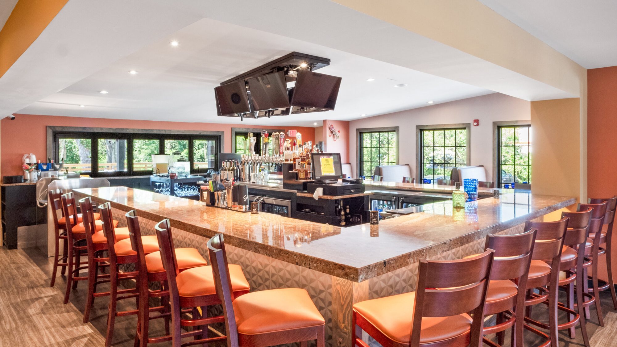 The bar, stools along its length