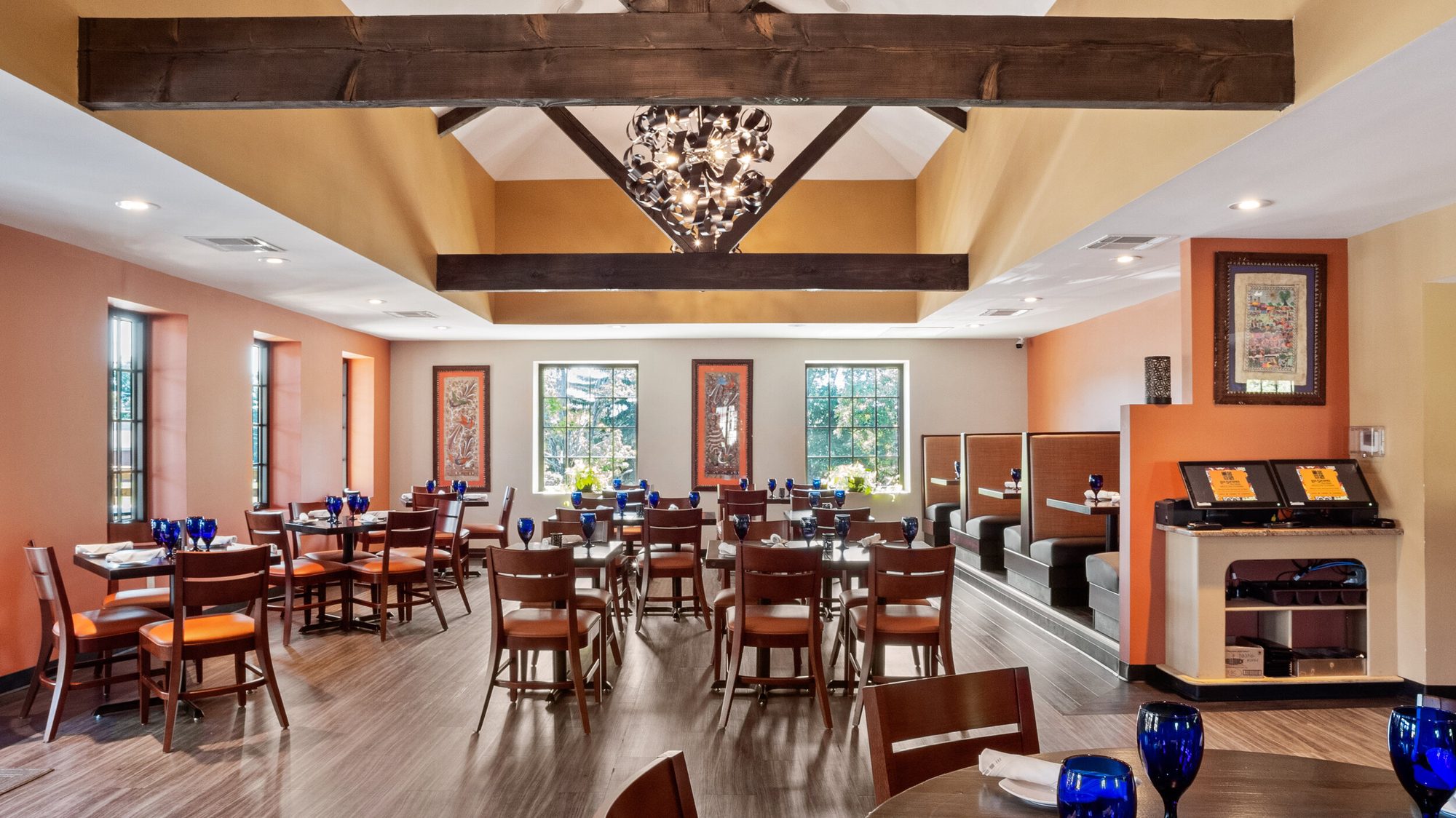Booths and tables under the beamed ceiling