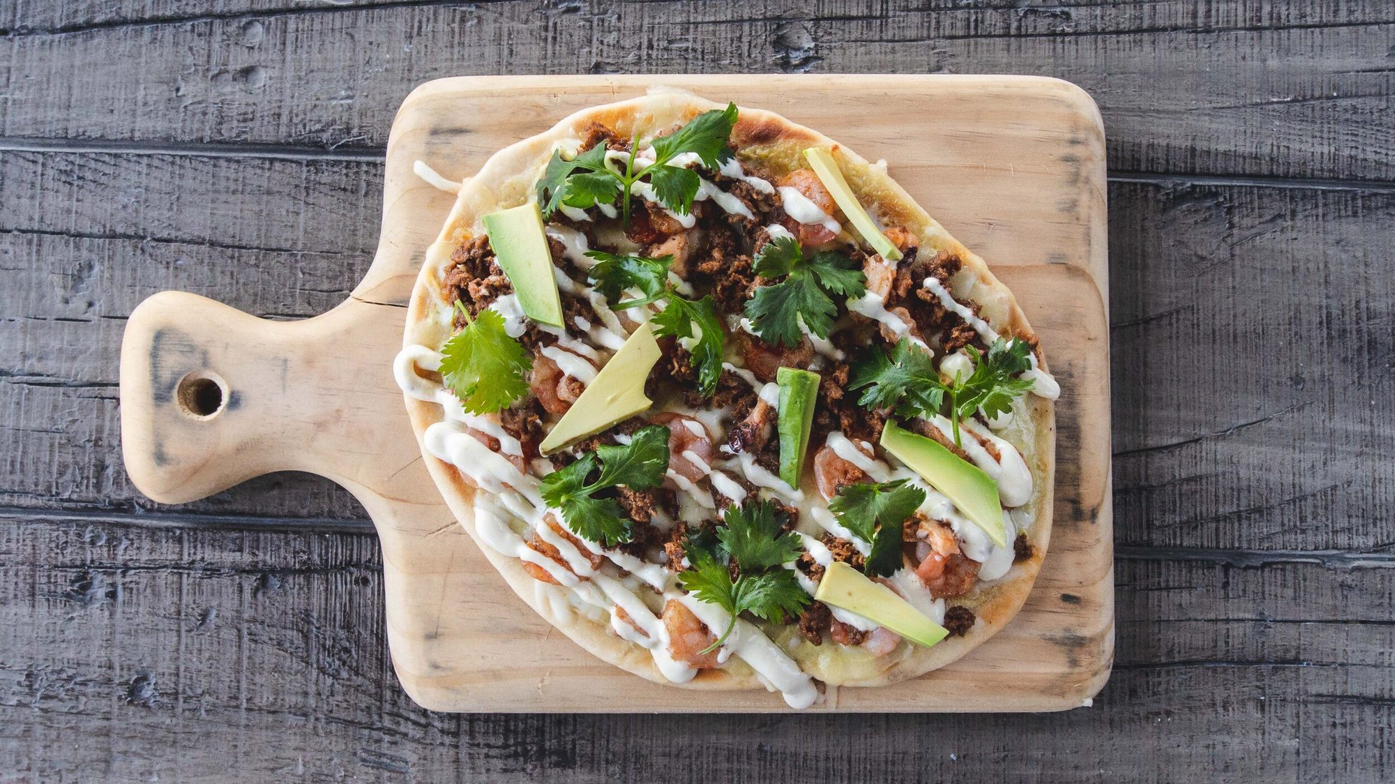 A shrimp flatbread seen from above