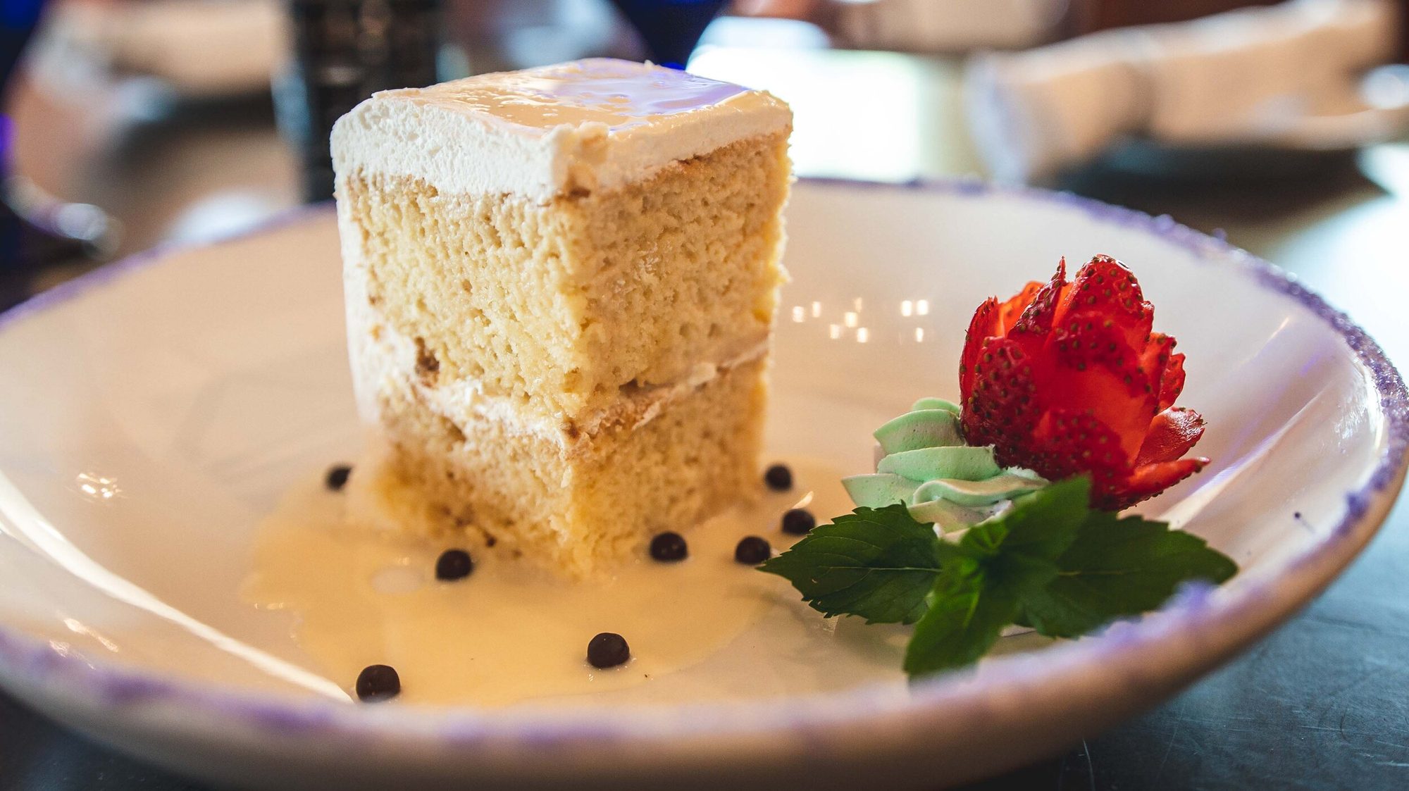 Tres leches cake in a pool of sauce