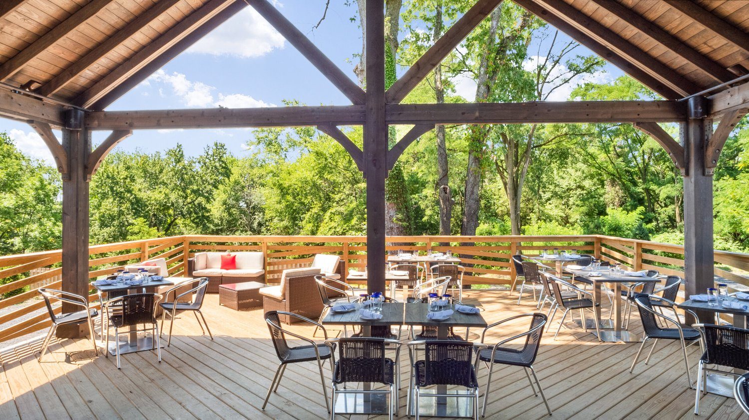 Tables and chairs across the patio decking